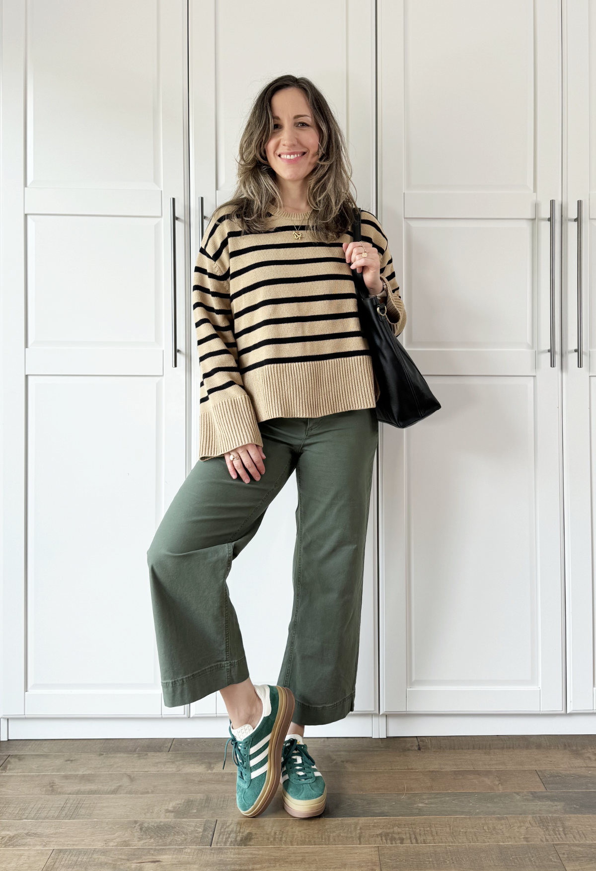 Olive green pants and tan striped crew neck sweater with adidas gazelle sneakers - fall outfit 

#LTKOver40 #LTKSeasonal