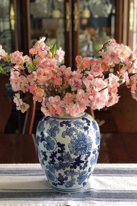 Blue and white porcelain ginger jar filled with pink cherry blossoms - a classic spring centerpiece!

#ltkflowers #ltkblueandwhite

#LTKSeasonal #LTKstyletip #LTKhome