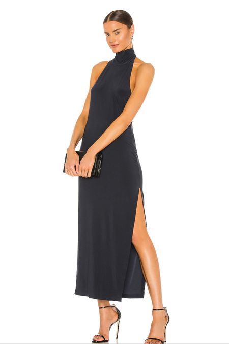 This navy blue halter maxi dress with a slit on the side is just perfect for a work party!