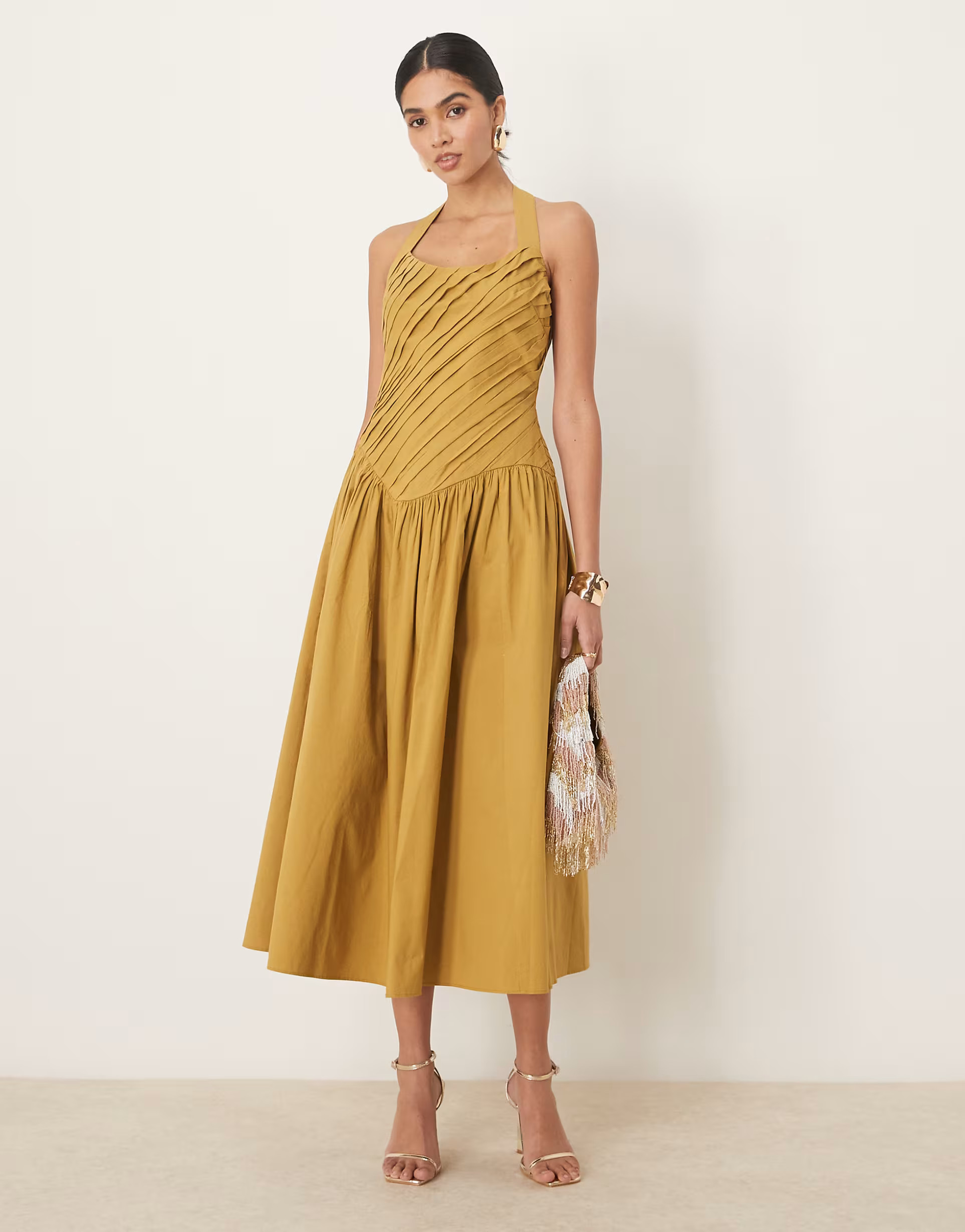 ASOS DESIGN halter neck asymmetric pleat bodice midi dress with dropped waist in turmeric | ASOS (Global)