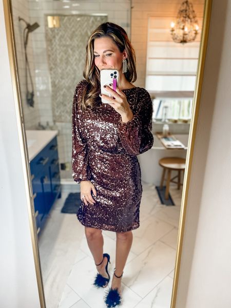 This sequin dress is a beautiful dark brown color and the cut is perfect for more reserved functions.  It does have a cut out at the top of the back but you can still wear a normal bra! Runs tts 

#LTKstyletip #LTKHoliday #LTKSeasonal