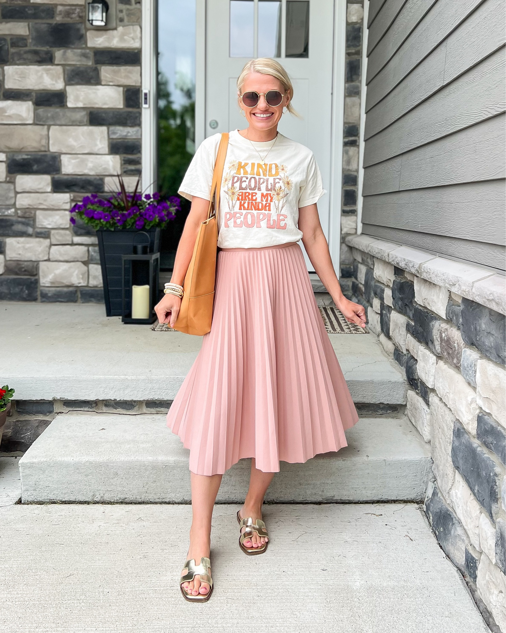 Easy mom summer outfit idea with a pleated skirt and graphic tee! 
T-shirt- xsmall
Skirt- small
Sandals- 7.5

#LTKSeasonal #LTKFindsUnder50 #LTKStyleTip