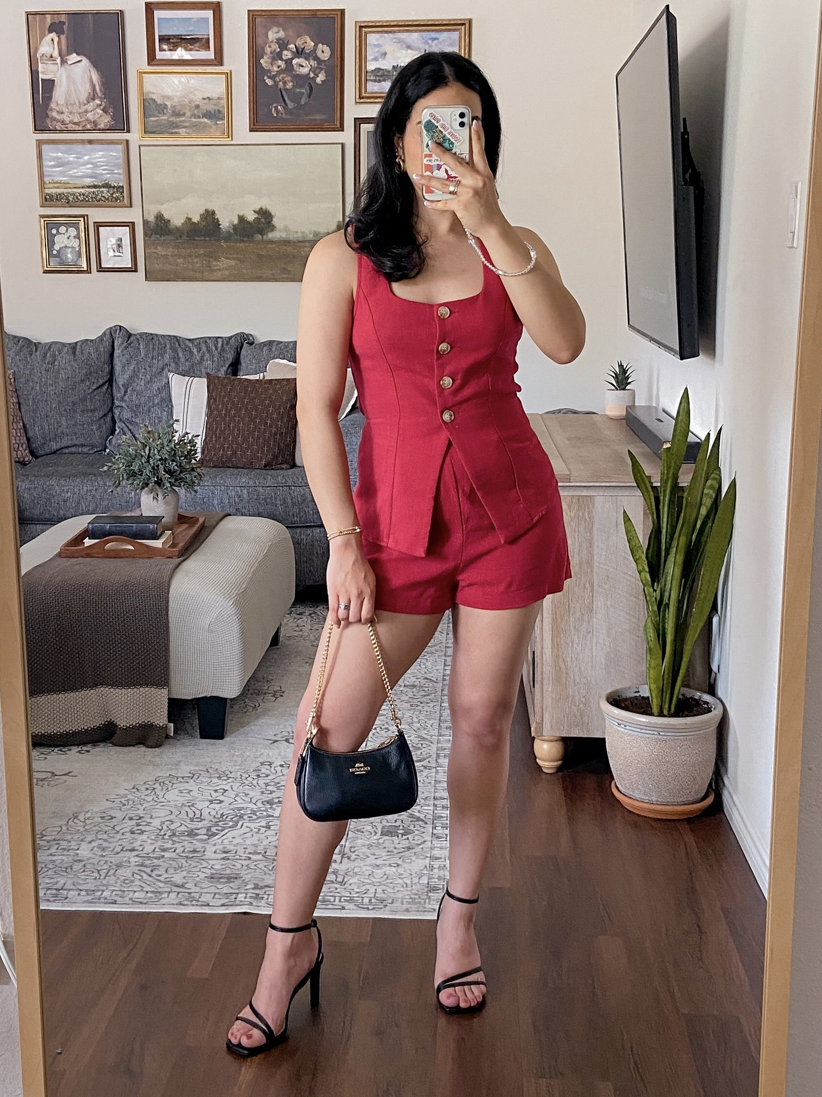 a pop of red is never a bad idea 💋🍒♥️🌹💃🏻🍓i’m wearing this set in a size medium and it fits true to size. the top has front button closures, tie back detail, and a split hem. the shorts have a side zipper closure with an elastic band in the back. the fabric looks like linen but has no stretch. i styled this set with black accessories and gold jewelry. 

#LTKSaleAlert #LTKSeasonal #LTKStyleTip