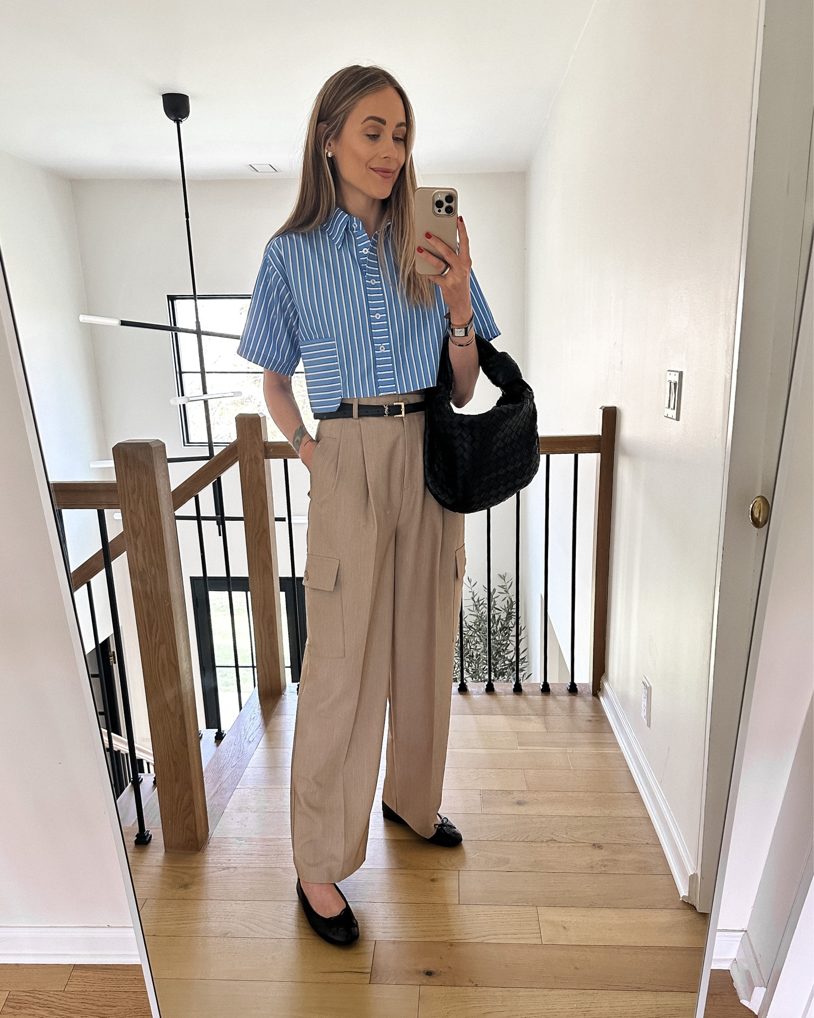 Fashion Jackson wearing spring capsule wardrobe, cargo trousers, black ballet flats, cropped striped shirt, bottega veneta handbag #fashionjackson #springoutfit #capsule #trousers #balletflats 

#LTKunder100 #LTKshoecrush #LTKstyletip