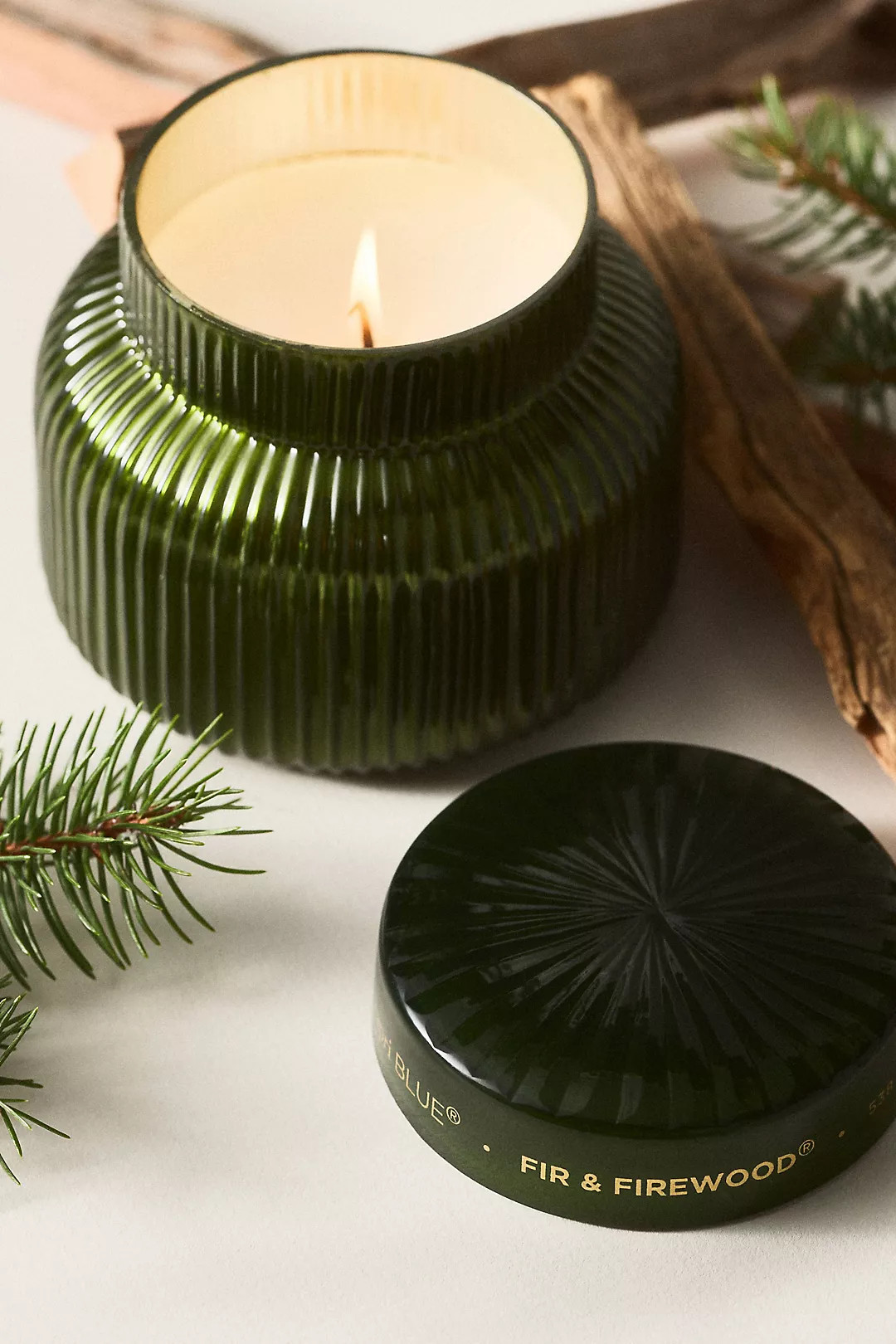 Capri Blue Woody Fir & Firewood Glass Candle | Anthropologie (US)