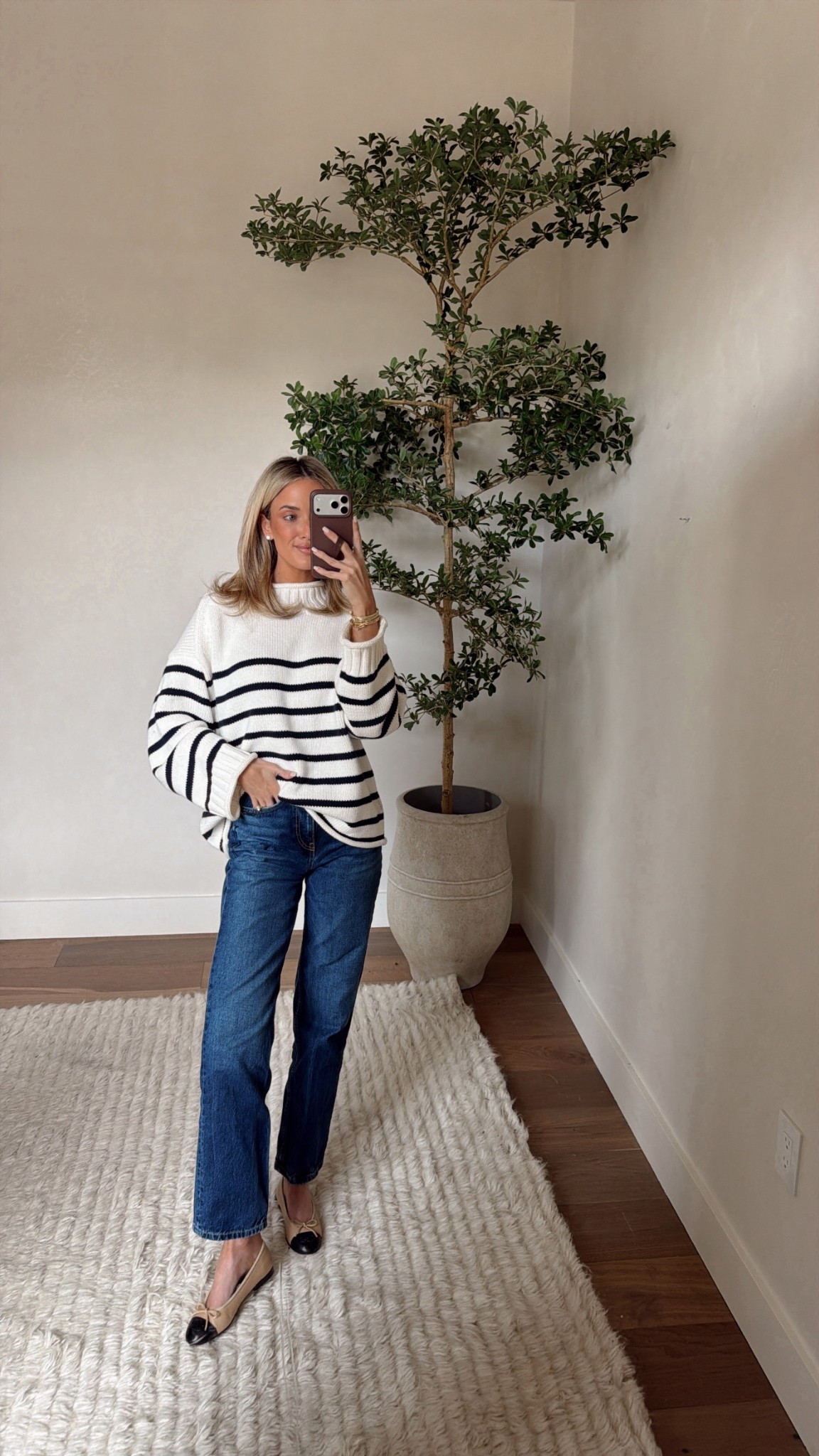 Wearing a S in the sweater! 

Planter is size large 
Tree is 7ft