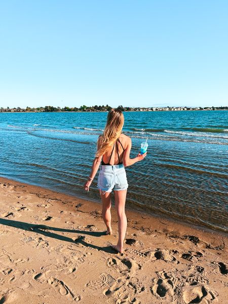 Beach outfit: my favorite black cutout one piece swim suit with high waisted denim cut off mom shorts (on sale!!). Also tagging my plush roundie beach towel and high pony tail hat that I had at the beach. 

#LTKswim #LTKtravel #LTKsalealert