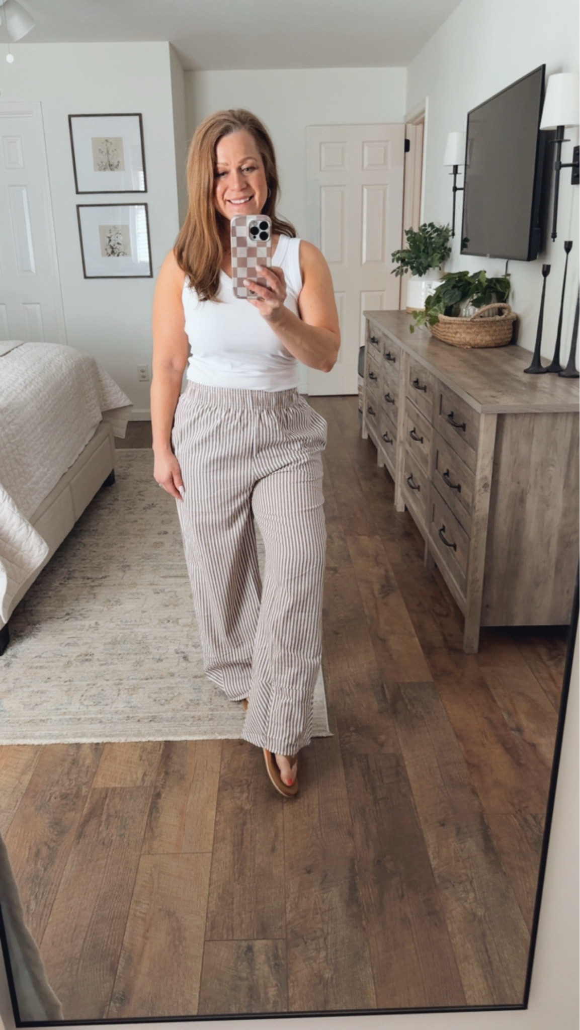 Spring/summer outfit inspo
V neck tank
Ticking stripe wide leg pants 
Sandals 

#LTKmomlife #LTKSeasonal #LTKPetite