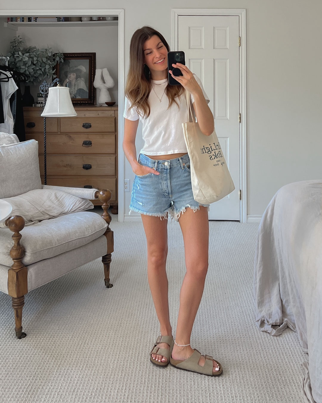 Capsule Wardrobe day 3 // Agolde shorts, Abercrombie tee, Birkenstock Arizona sandals, and a canvas tote bag. 

#LTKShoeCrush #LTKFindsUnder50 #LTKBacktoSchool