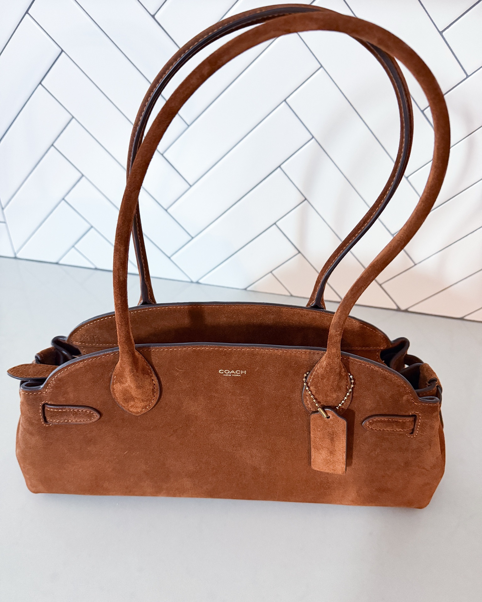 My newest Coach bag & such a timeless addition to my fall wardrobe. The rich suede, classic shape & warm brown color make it the perfect everyday bag for fall.

Coach bag - Coach handbag - suede bag - brown suede bag - fall handbag - fall accessories - designer handbag - classic handbag - timeless style - everyday bag - shoulder bag - fall fashion - fall wardrobe - quiet luxury - neutral accessories - Coach fall bag

#LTKU #LTKootd #LTKOver40