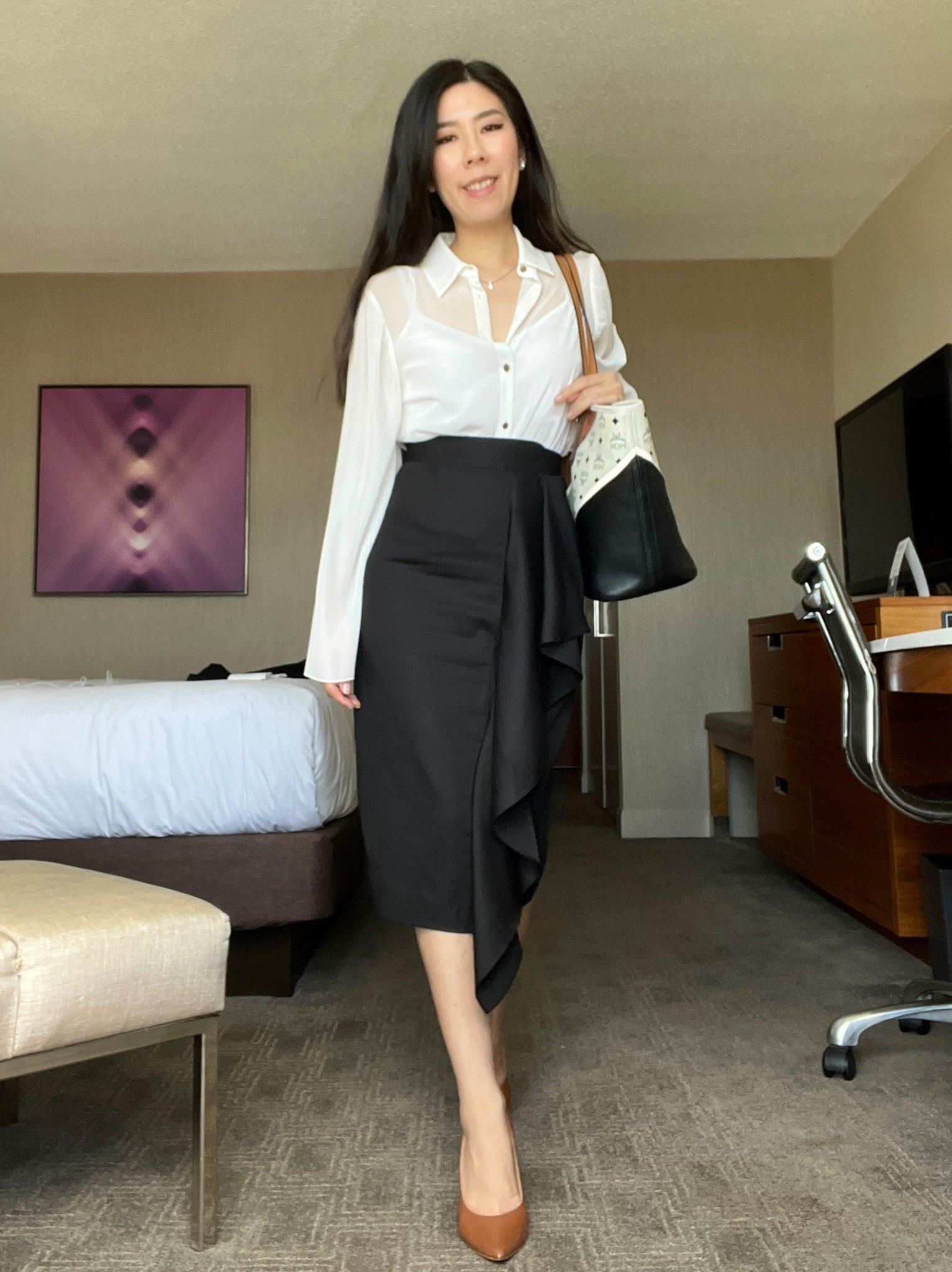 Black and white looks dominate my corporate rotation. I love this sheer collar button down top with pleated sleeve details - it’s always a conversation starter! To make this look professional, I paired it with a high waisted midi pencil skirt. Of course, I didn’t want it to be just a basic skirt so I found this one with a ruffle flowing down the side. I wore this to an all day conference and a quick evening reception in the evening. #businesscasual #oldmoney #pencilskirt #corporatestyle #blackandwhiteoutfit

#LTKPetite #LTKWorkwear #LTKootd