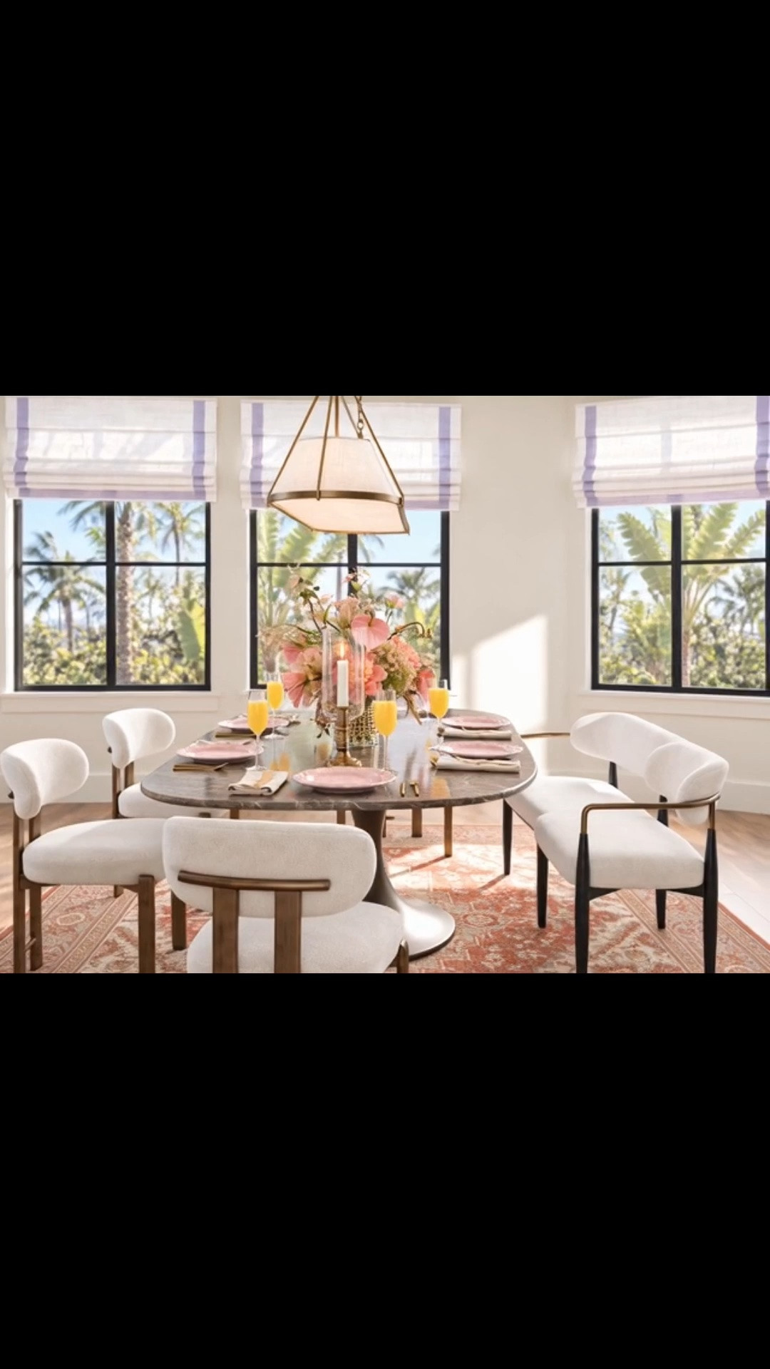A dining room ready for the holiday get-togethers ahead. ✨ The rich chocolate-brown marble table and sculptural warm metal base give the space its character, while the patterned rug, upholstered chairs, and bench make it feel warm and inviting.

A modern-classic chandelier and tailored Roman shades frame the setting. Fresh flowers, pink dinner plates, woven placemats, fluted champagne glasses, and hurricane candle holders finish a tablescape made for long meals together.

Arhaus up to 50% off is ending soon—the perfect time to refresh your dining room for the holiday gathering season.

#DiningRoom #DiningRoomDesign #DiningRoomInspiration #HolidayGathering #HolidayEntertaining #DiningTable #MarbleDiningTable #DiningChair #DiningBench #AreaRug #Chandelier #RomanShade #FlowerArrangement #Tablescape #Tabletop #Dinnerware #Placemat #ChampagneGlasses #HurricaneCandleHolder #ModernClassic #Arhaus #LTKdayinmylife #LTKHome #LTKSaleAlert

#LTKSeasonal #LTKHome #LTKSaleAlert