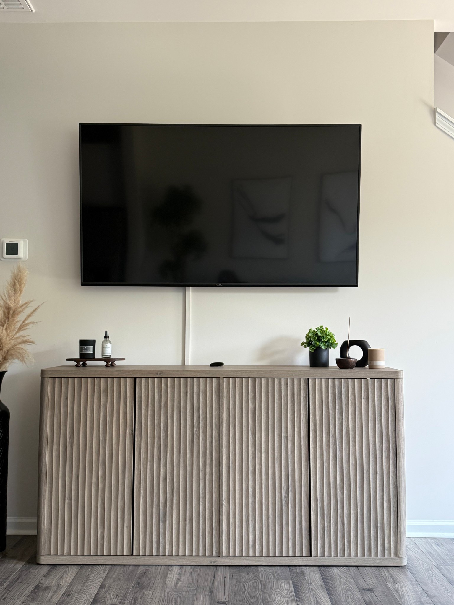 This accent cabinet from Amazon really elevated our space! The color blends perfectly with our space really lightened up this area. It’s durable, sturdy, and sleek, which is everything we were looking for!

#LTKHome