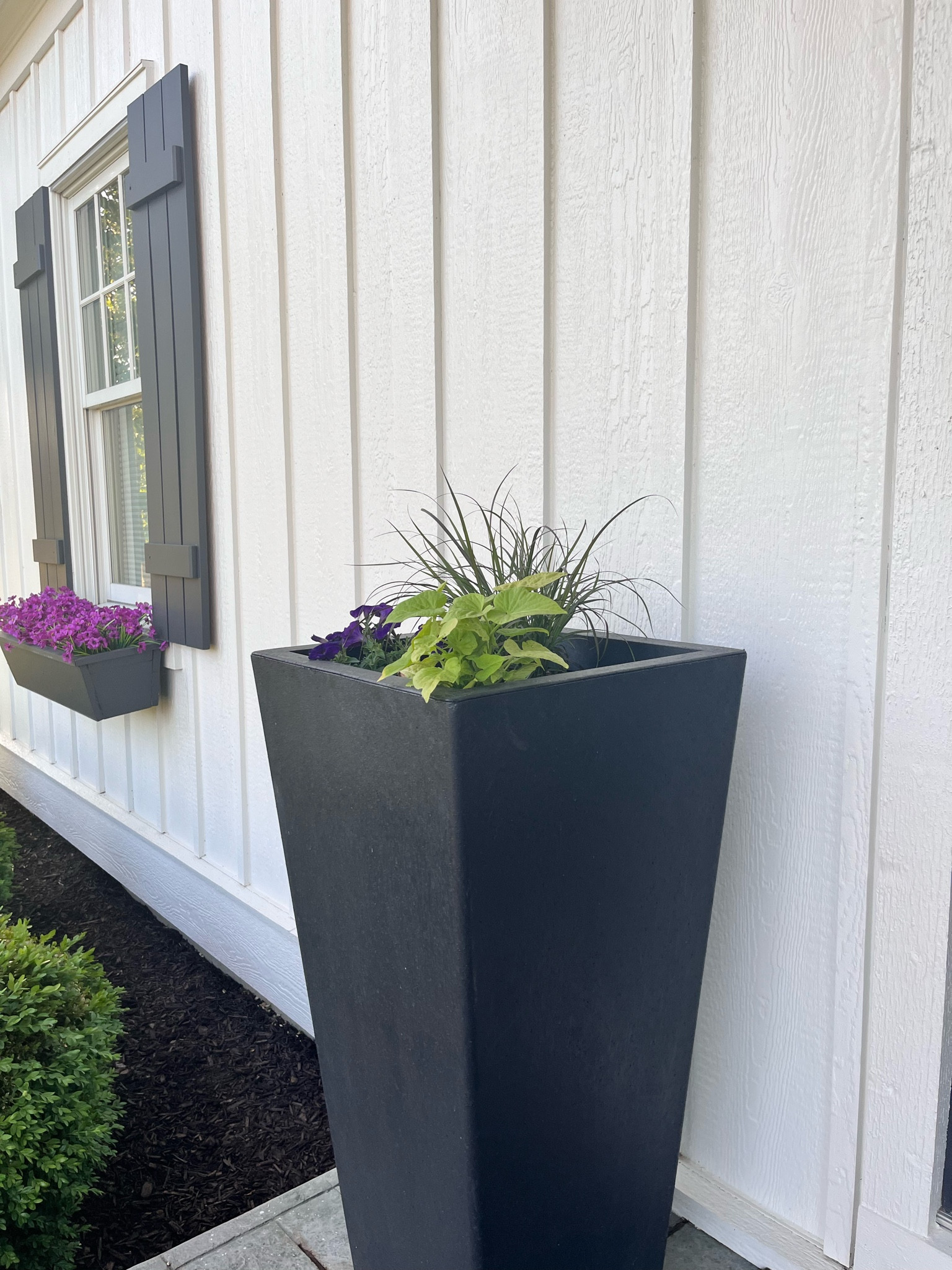 The BEST self - watering planter ! And faux florals in that window box!

#LTKSeasonal #LTKHome #LTKSaleAlert