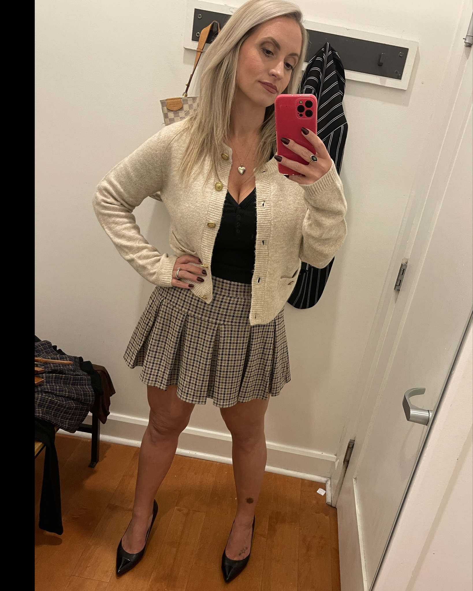 This brought me back to the early 2000s, but I need more length for my age now. *crying* AE has the skirt in long lengths online but are sold out in the long right now in my size  

Wearing a medium in everything. The skort is stretchy and has little shorts built in. The cardigan was SO soft and you can never go wrong with too many basic henley tops. 

#LTKMidsize #LTKFallSale