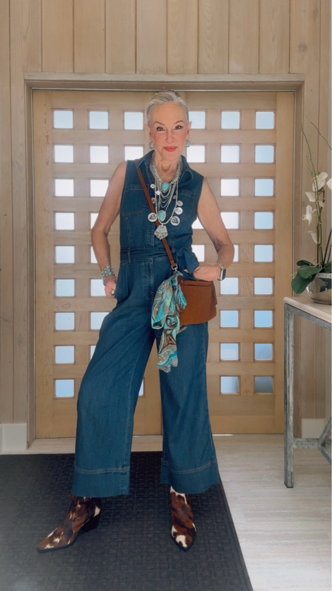 Denim wide leg jumpsuit 
Turquoise statement necklace
Georgette blouse
Suede bag 
Pony print calf hair bag
Faux suede fringe Ruana 
Gold slides
I wear a size 0 in Chico’s unique sizing

#LTKSaleAlert #LTKOver40 #LTKFindsUnder100