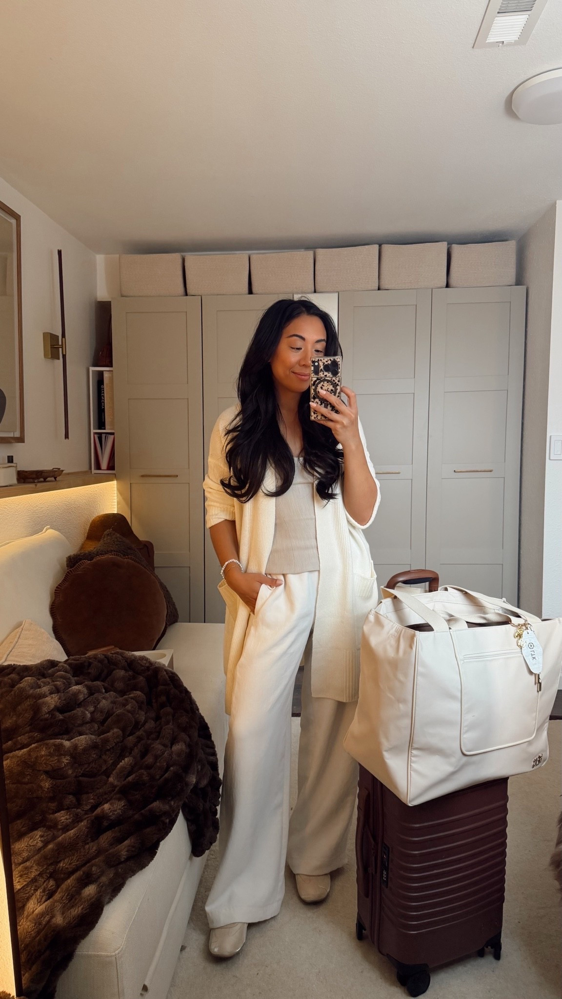 Travel outfit for our flight to Italy! Wearing size S top, S pants. Cardigan is Naked Cashmere, I linked similar below!

#LTKootd #LTKTravel #LTKgrwm