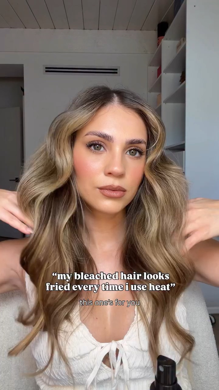 extensionless at the moment! methods & things I swear by in my bleached hair routine: 

- heat protectant generously to prevent further damage. Liking @lolavie lately! Smells good & not heavy

- low heat. do your best! I am for the lower numbers or less than half the maximum heat. this video I used the @thebeachwaver 1.25 inch. 

- when done styling, seal in the split ends. idk what is in the @moroccanoil split end mending fusion but it really works to temporarily seal it.

- @moroccanoil purple hair oil,  my hair colorist told me that most hair oils are not suitable for blondes because naturally they are gold or yellow which makes hair brassy. avoid those! I got a purple tinted one to prevent oil from staining my hair. 

#bleachedhaircare #healthyhair #blondehair #hairproducts #finehair
