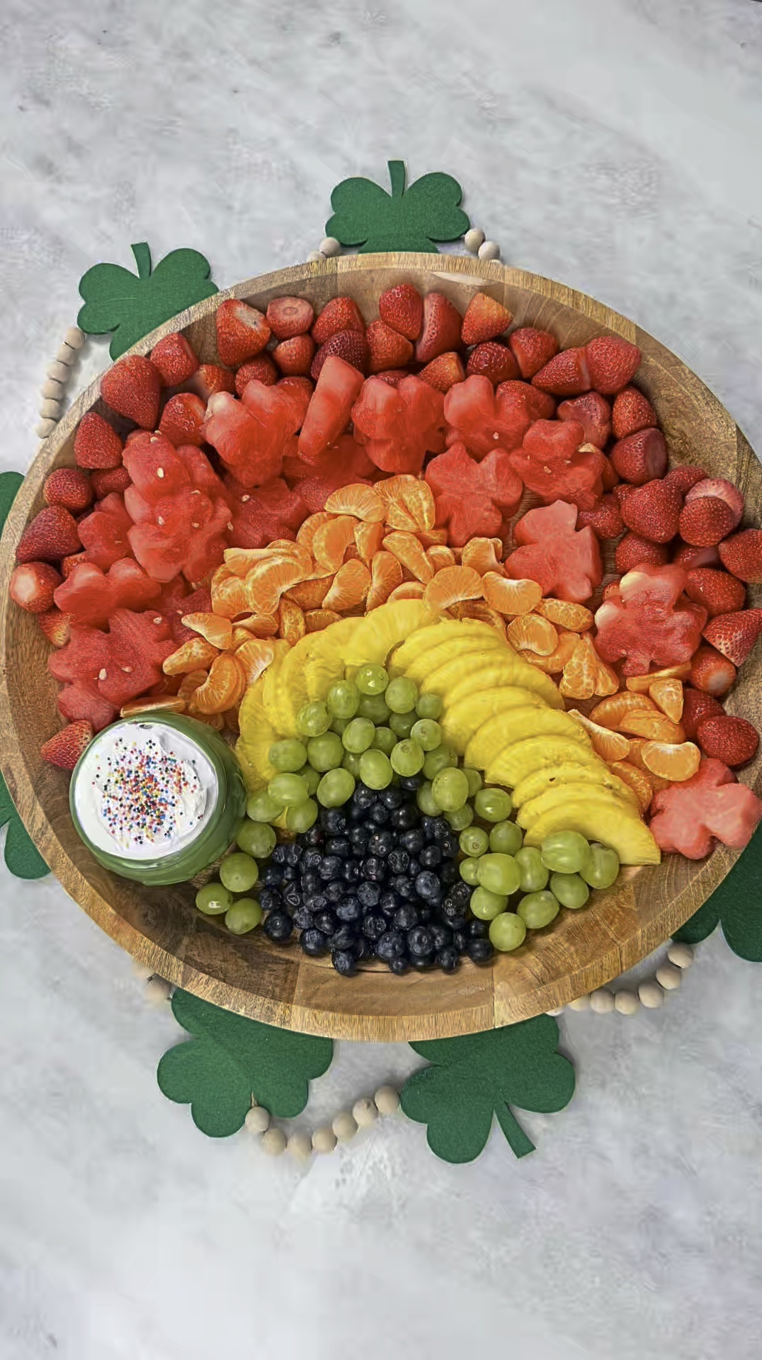 A Festive St. Patrick’s Day Fruit Platter

Looking for a fun and festive way to celebrate St. Patrick’s Day? I put together this colorful fruit platter, perfect for any gathering! I created a rainbow using strawberries, watermelon shamrocks, oranges, pineapples, green grapes, and blueberries. At the end of the rainbow, I placed a green “pot of gold” filled with a creamy fruit dip and topped it with rainbow sprinkles for a magical touch!

This is such an easy and healthy way to add a little holiday spirit to your table—plus, it’s kid-approved! Would you make this for St. Paddy’s Day? 🌈🍀✨ 
St. Patricks Day, Fruit Platter, Rainbow Fruit @target

#LTKHome #LTKFamily #LTKWatchNow