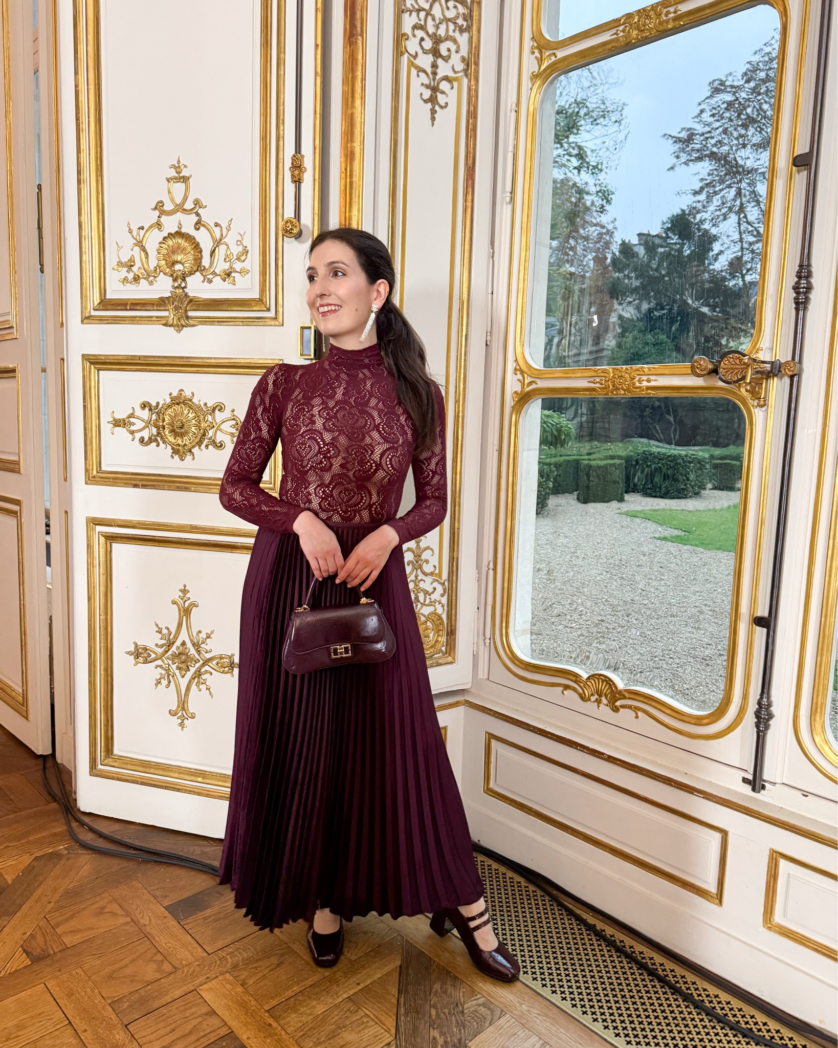 The second outfit that I wore at Paris fashion week was a total burgundy look!

I wanted the star of the look to be this lace top so I combined it with a simple pleated long skirt in wine colour, matching coat, shoes and bag. For jewellery I chose a pair of Chanel long gold earrings with rhinestoned and a rose gold ring that in the end forgot to wear 🙈

Underneath the top I wore a nude colour strapless bodysuit but I tried as well with a nude colour bra and you can’t see it. I chose the bodysuit in the end for extra layer of warmth and shaping. 

What do you think about this look?

#LTKeurope #LTKstyletip #LTKpetite