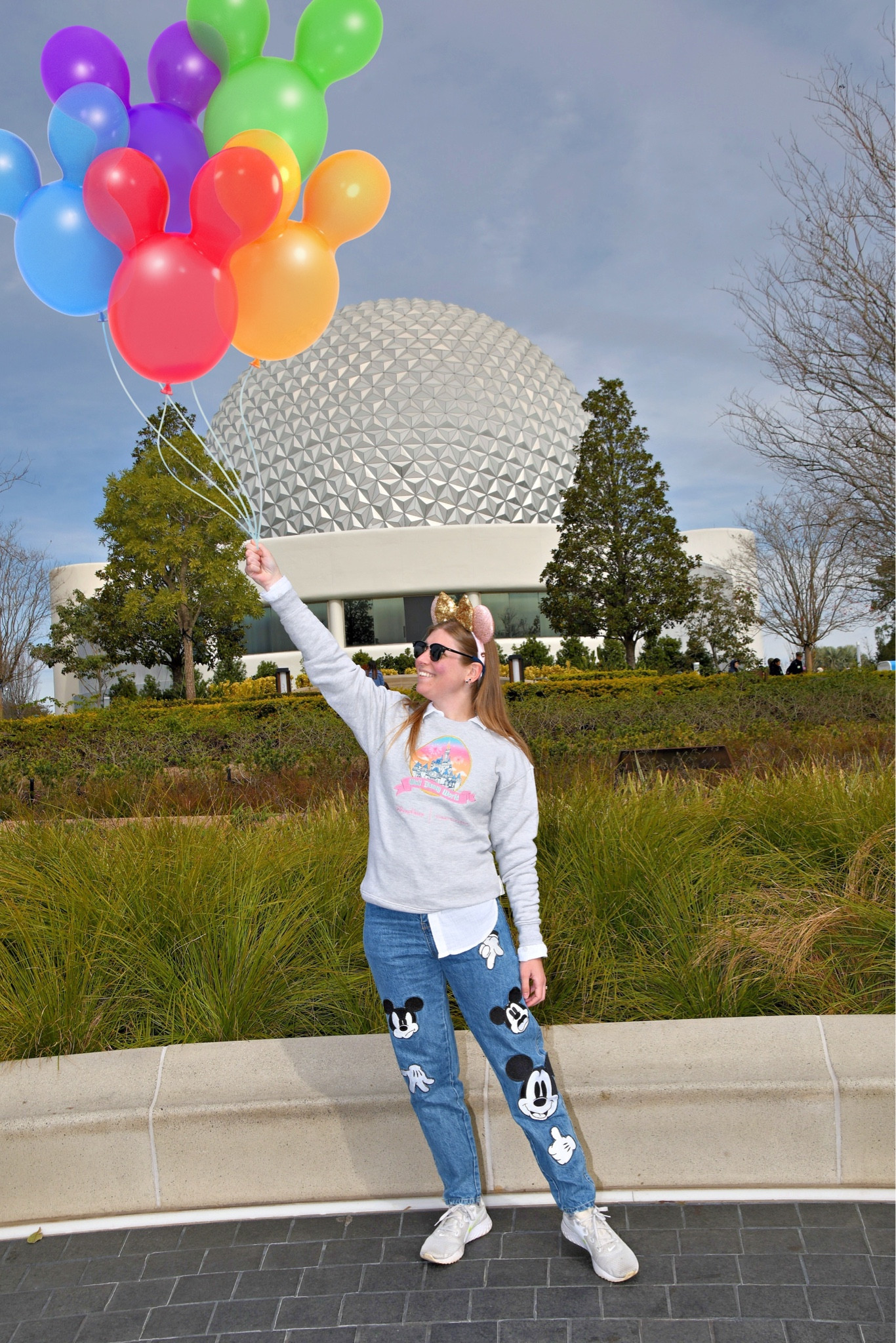 Winter Disney outfit with castle sweater from Stoney Clover and Mickey Mouse jeans  
