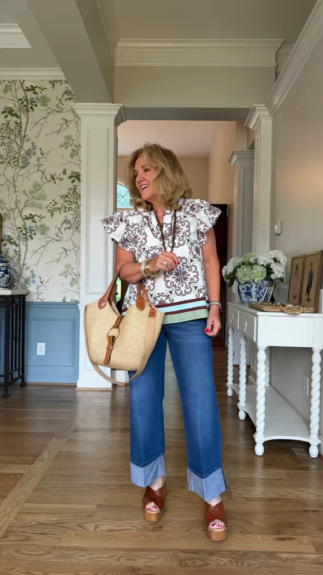 This printed ruffle-sleeve top adds a feminine touch to these wide-leg cuffed jeans. The relaxed silhouette, pretty pattern, and woven tote make this an easy polished look for warm-weather days.

💡 LTK MADE EASY
❤️ Heart = Support my posts!
🔖 Save = Get sale & restock alerts
📋 Lists = Keep favorites organized
📲 Share = Send lists and products to a friend. Hello, Christmas List!
💬 Comment = Ask me anything about what I'm wearing.:-)

#LTKootd #LTKdayinmylife #LTKOver40