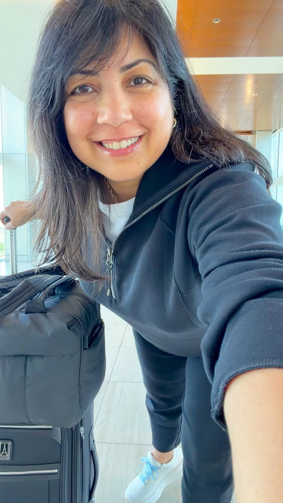 Spanx Air Essentials Sale! 25% off regular price AirEssentials pieces with code AE25. Such a great sale! Lots of other styles already on sale and deeply marked down. Love this Spanx Air Essentials set as a travel outfit. So soft, comfy and cozy and great for airport outfits and long flights! Wearing size large in the top and large petite in the pants. This barrel leg pant style is new for me and so far I’m loving the silhouette! Grab this classic top for 25% off and the pants for under $50! Brooks sneakers. CALPAK Luka duffel travel bag. Travelpro carry-on suitcase luggage.

#LTKMidsize #LTKPetite #LTKTravel