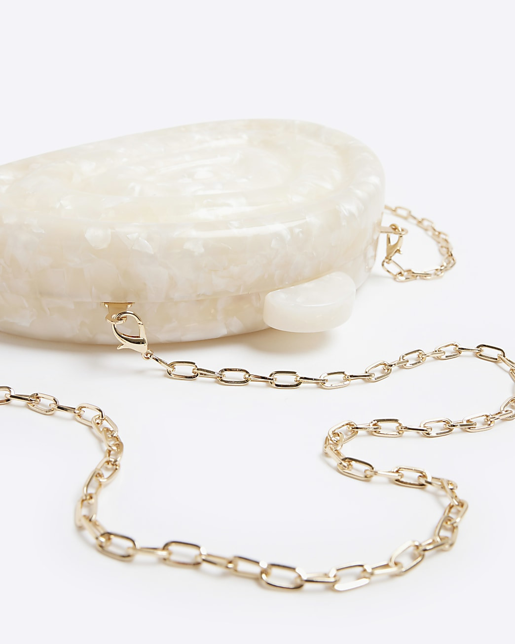 Cream hard shell clutch bag | River Island (UK & IE)