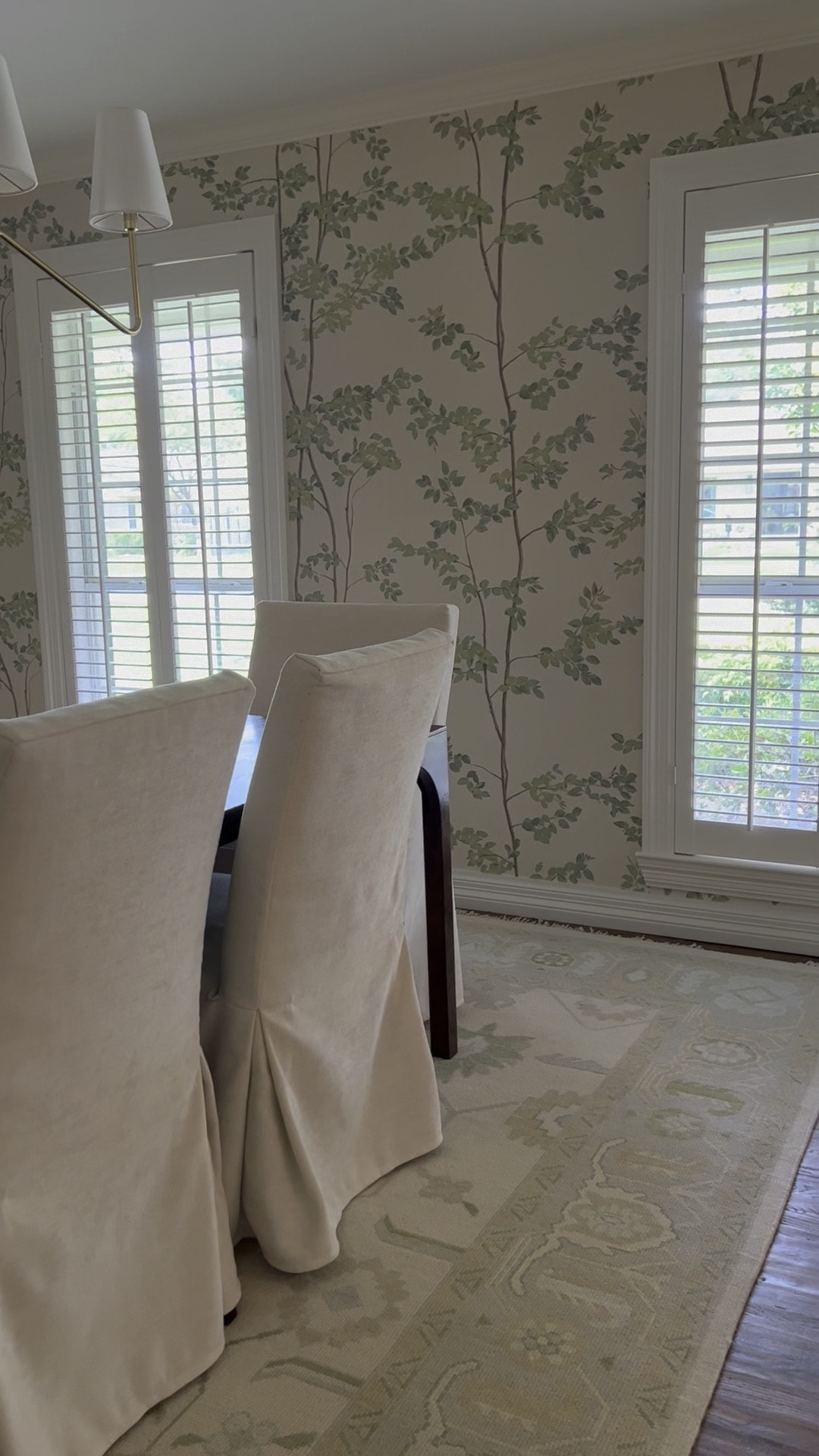 Oushak rug, cream rug, neutral green area rug, dining room rug, quality rug, lighting, chandelier, gold chandelier, dining table, slip cover chairs, wallpaper, green room, home decor finds, interior designer finds, classic, timeless decor

#LTKfamily #LTKhome #LTKsalealert