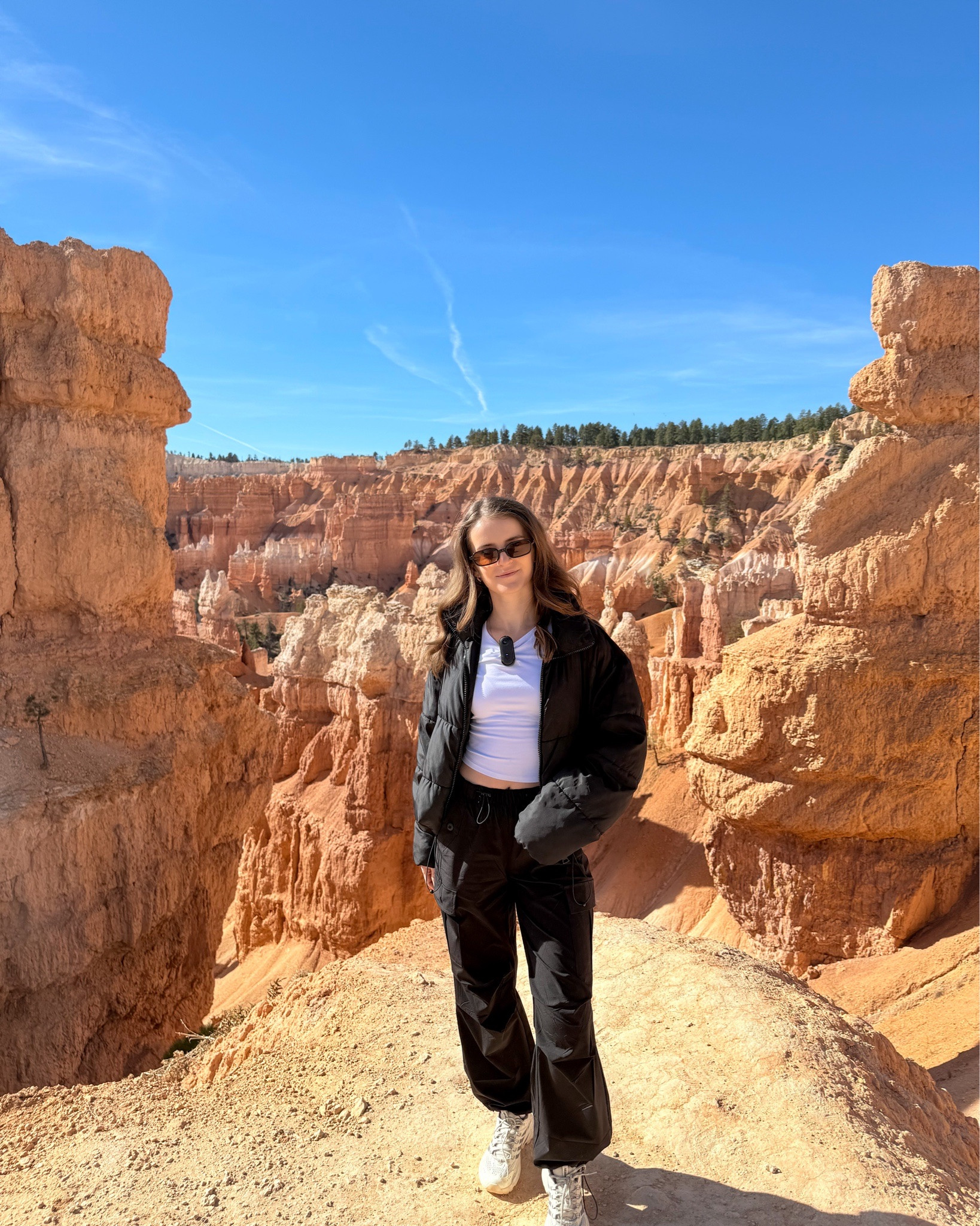 Black puffer jacket with parachute cargo hiking pants for a winter outfit idea that works for travel, cold weather hikes, or everyday basics. Styled with a white long-sleeve workout top, Merrell Moab Speed 2 hiking sneakers, hiking socks, and my hiking backpack.  Comfortable, practical, and perfect for on-the-go days.
.
.
.
.
.
.
#LTKCyberWeek #LTKGiftGuide #LTKdayinmylife #LTKootd #LTKSeasonal #LTKActive #LTKU #LTKSaleAlert #LTKFindsUnder50 #LTKFindsUnder100 #LTKTravel 

Winter jacket | winter athleisure outfits | winter hiking outfit | winter outfit inspo | cropped puffer jacket | gorpcore | cargo pants outfit | cargo joggers | hiking shoes | winter travel outfit | athleisure outfits | cold weather layers | cold weather outfits | basic tops | 