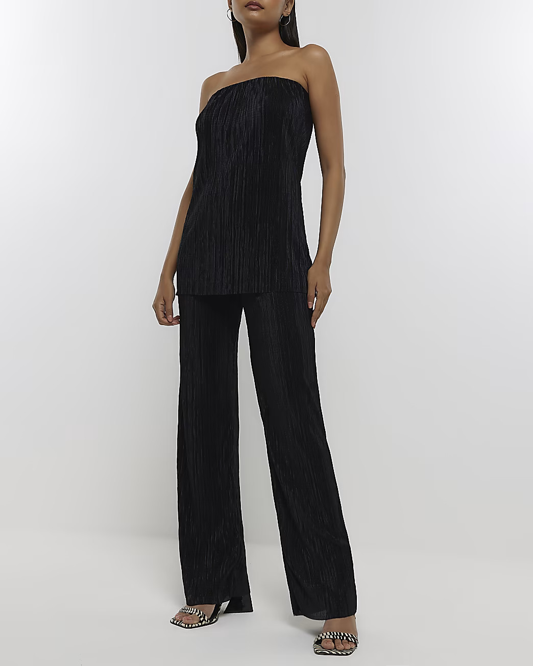 Black plisse flared trousers | River Island (UK & IE)