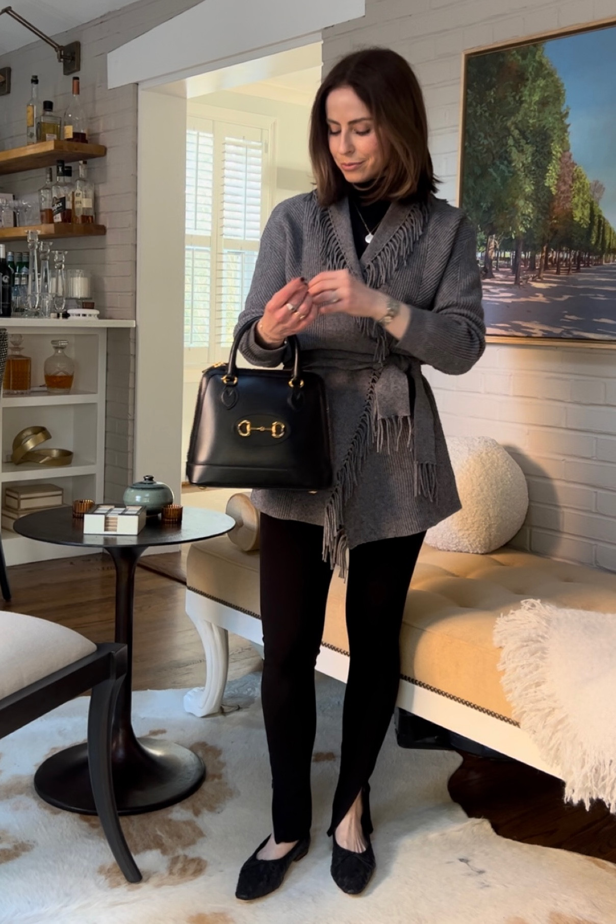 Black Mock neck body suit from Commando
Black zip hem leggings from Toteme
Grey fringe cardigan from Splendid
Black woven ballet flats loeffler Randall 

#LTKshoecrush #LTKstyletip #LTKsalealert