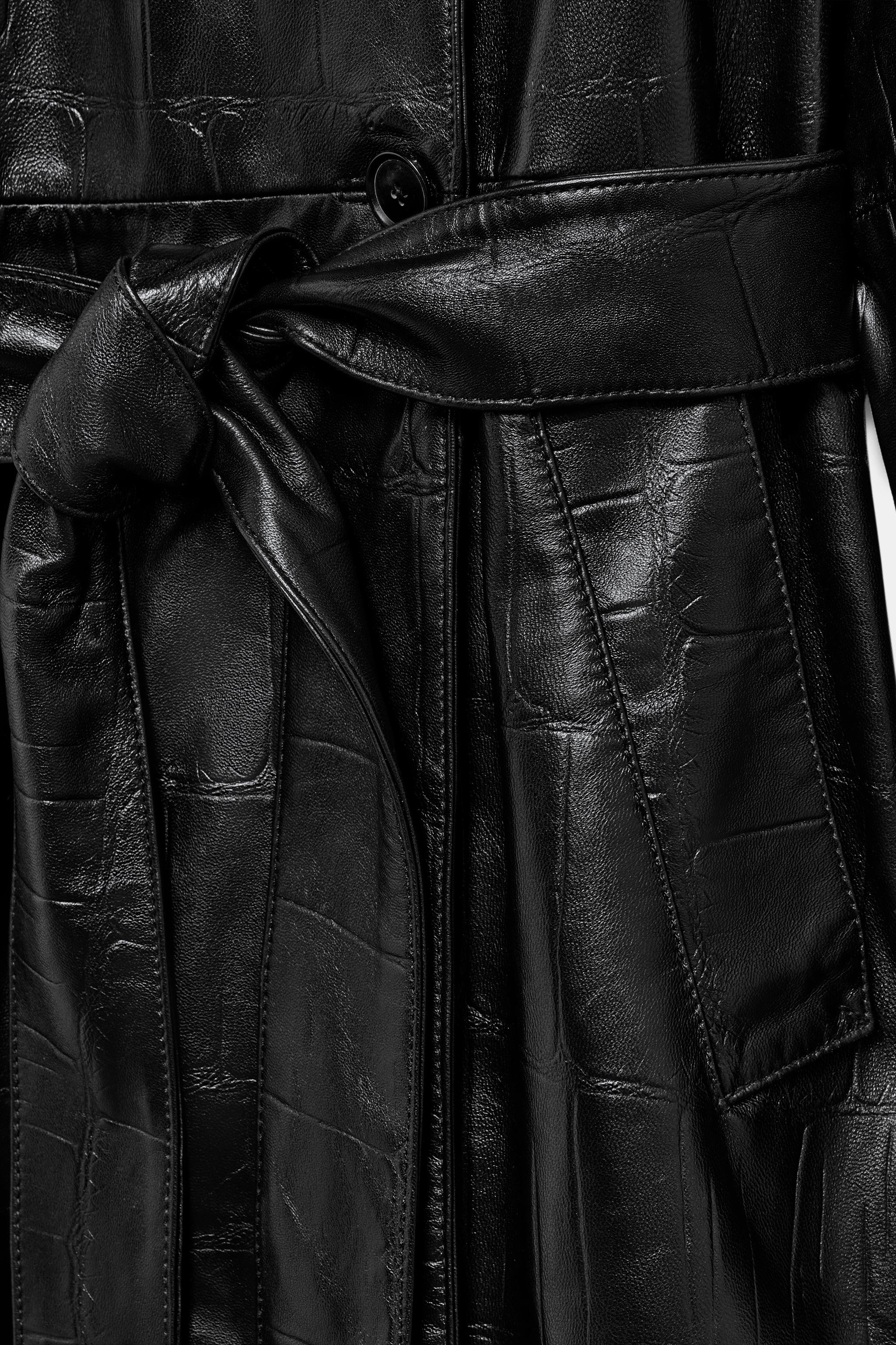 ZARA WOMAN COLLECTIONLong trench coat made of 100% leather. Notched lapel collar and long sleeves... | Zara US