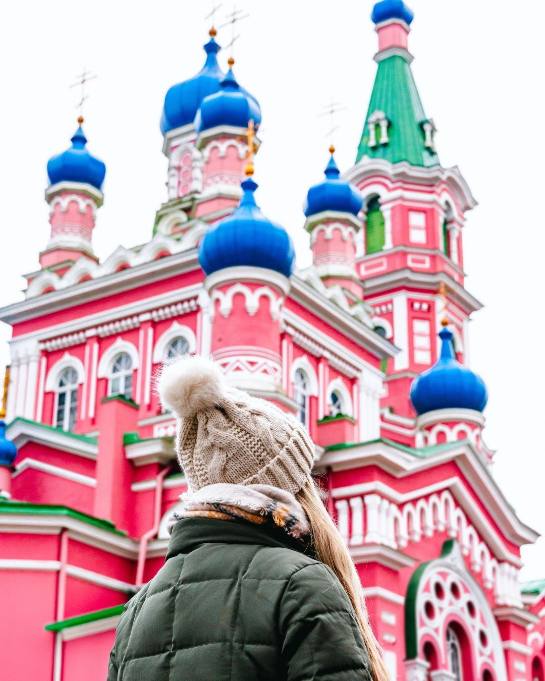 Bundled up and exploring one of the most colorful buildings we've ever seen. 

 #LTKTravel