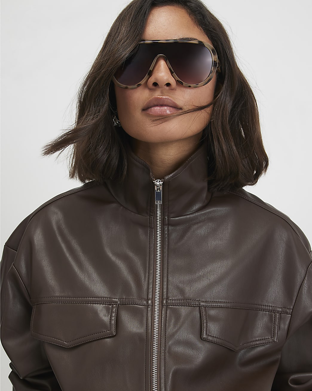 Brown Faux Leather Drawstring Funnel Jacket | River Island UK & IE
