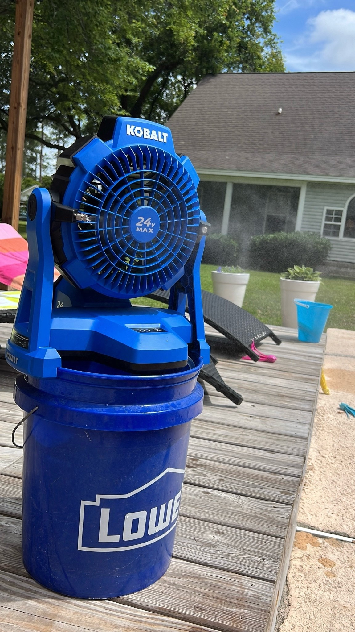 Battery fan with misting option: three fan speeds and three misting speeds — fits perfectly on top of a five gallon bucket