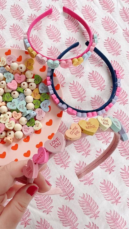 I spotted these candy heart inspired beads when I was researching Valentine's Day ideas and knew I couldn't pass them up! A few plain headbands, and a little hot glue gun DIY'ing and voila! We've got ourselves some pretty darn cute conversation heart headbands, don't you think? It's been a long time since I've had some DIY content on this page, and it makes me realize how much I miss it, gotta do more projects like this, because the hot glue gun sparks joy! Tagged all the supplies in my stories if you want to DIY some candy heart headbands for yourself, it was such an easy project, I promise, anyone can do it! #DomestikateDIY 

#LTKSeasonal