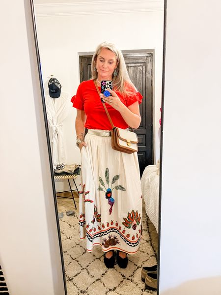 Ootd - Monday night. Red t-shirt with ruffle sleeves, a beige maxi skirt with colorful print (Shoeby x Lonneke Nooteboom), Mango bag that looks exactly like the Celine triomph bag. Vivaia Mary Jane shoes. 

#LTKspring #LTKeurope #LTKnederlands