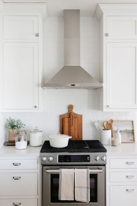 I love to warm up my all-white kitchen with wood accents like cutting boards, risers, wooden spoons and artwork frames  

#LTKFind #LTKhome #LTKstyletip