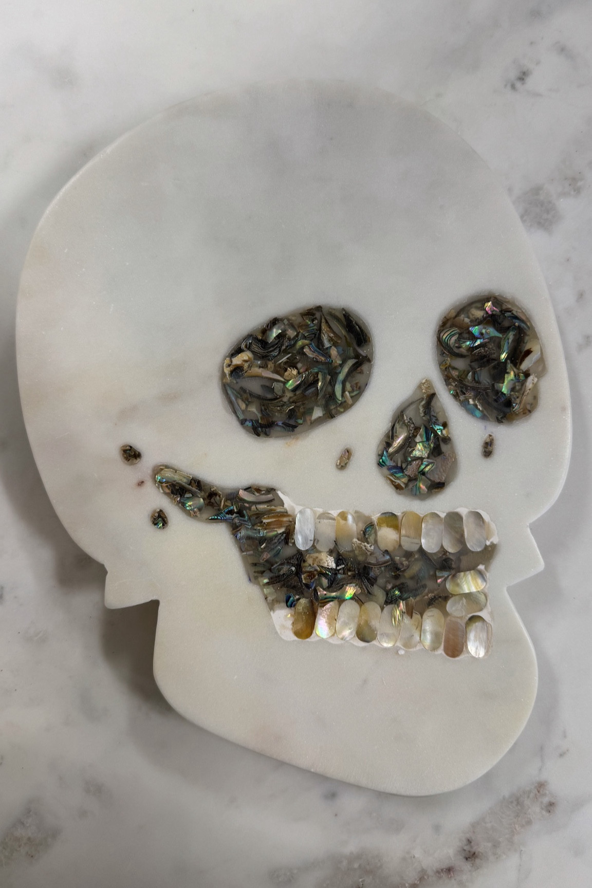 Halloween Decor ✨ Skeleton Cheese Board. This marble and mother of pearl skeleton cheese board is perfect for Halloween party hosting or as a hostess gift. Love the inlay detailing, Anthropologie inspired. 

Halloween 2024

Skull, skull cheese board, Cheese board, charcuterie, marble, mother of pearl, pearl inlay 

#LTKHome #LTKHalloween #LTKSeasonal