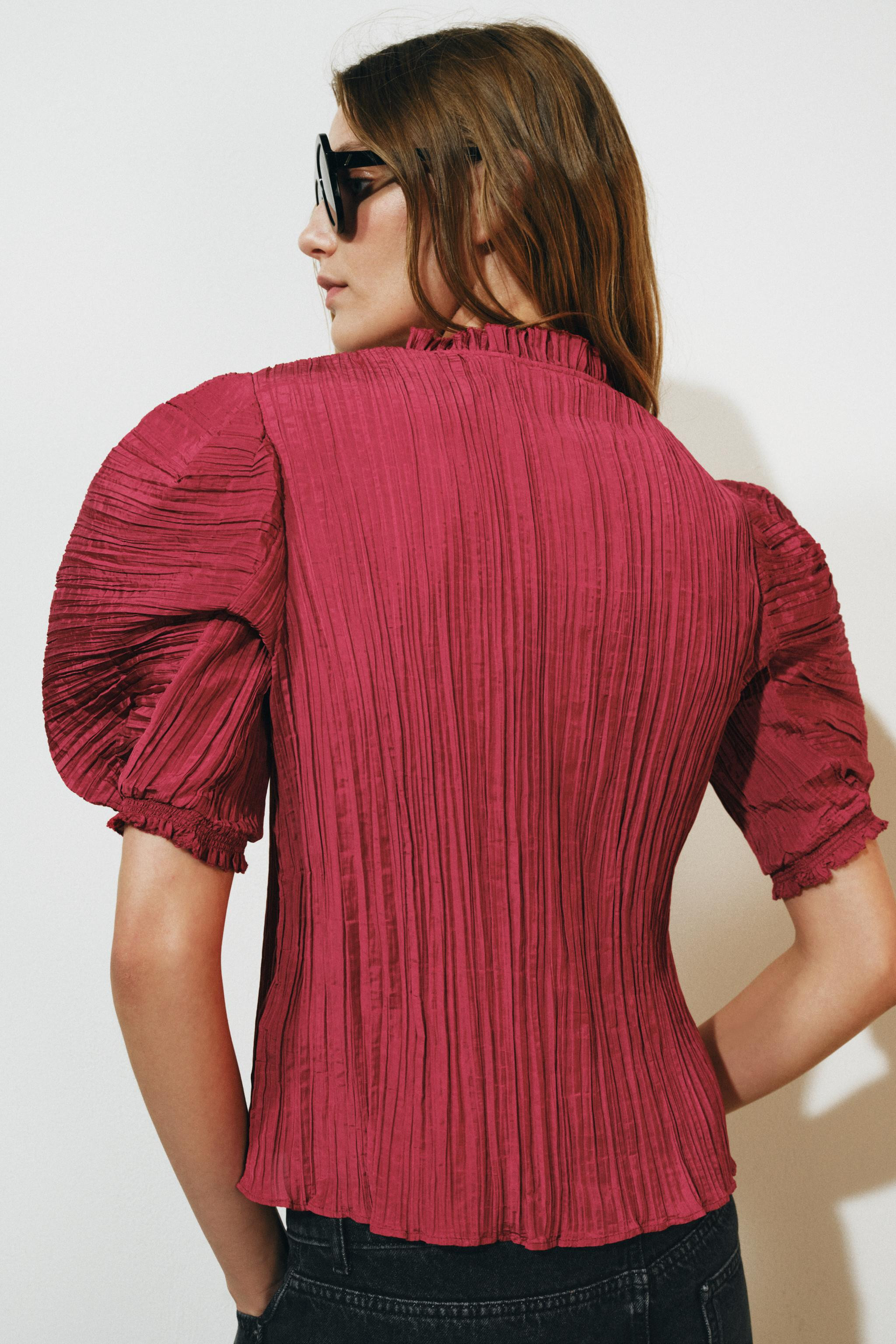 ZARA WOMAN COLLECTIONShirt with a round neck and short puff sleeves. Features pleated fabric deta... | Zara US