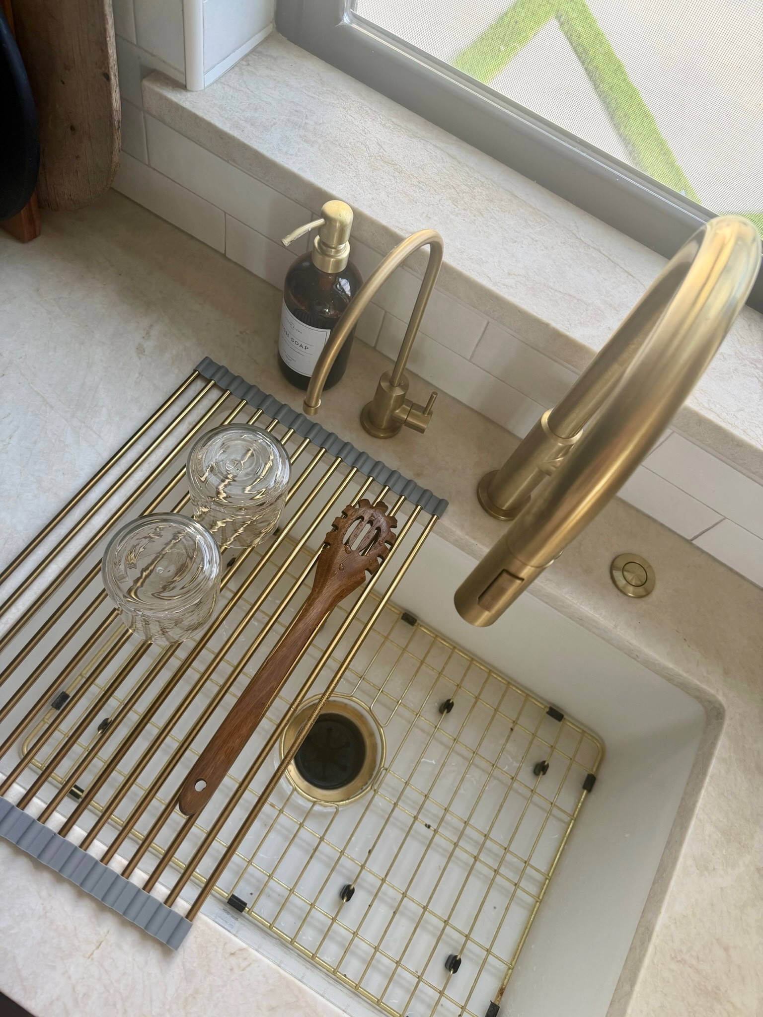 I use this "roll-up sink drying rack and brass sink grid" to keep the kitchen sink area clean and organized without taking up counter space. The rack is perfect for drying glasses, utensils, or produce, and it rolls away easily when I want the sink completely clear.

I like simple kitchen tools that make everyday routines easier while still looking polished. These pieces protect the sink, help dry dishes, and keep the space tidy. I’ve linked the ones I use below.
@Wayfair 
@Amazon 
@Walmart

#LTKU #LTKHome #LTKSaleAlert