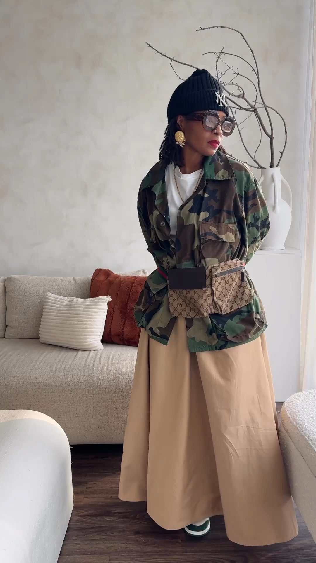 Day 27 … this look was built around this skirt I got over the summer from @mango! I just love the front pocket details. This is what I consider a great staple piece as it can work easily with anything in my wardrobe ! Wanted a street style look so paired it with my favorite tee from @cos, my good old thrifted camo jacket.. and these @nike dunks I didn’t know I would grow to LOVE’ 

Always reppin @juliavaughn on the Yankees broach and earring! 
Fanny - old Gucci 
Glasses- @ifyoudareaccessories


#LTKFindsUnder100 #LTKMidsize #LTKSeasonal