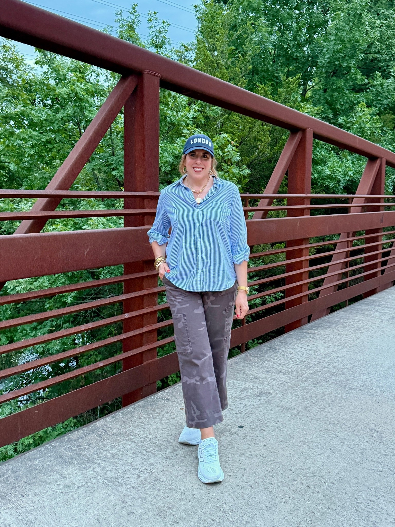 $17 viral pants! New dark camo color, extremely comfortable for travel or any activity- I threw on my walking shoes and walked in them at the end of a long travel day. I hemmed mine for a cropped fit and mixed patterns with a blue and white striped shirt.  
Pants sz. M

#LTKootd #LTKOver40 #LTKTravel