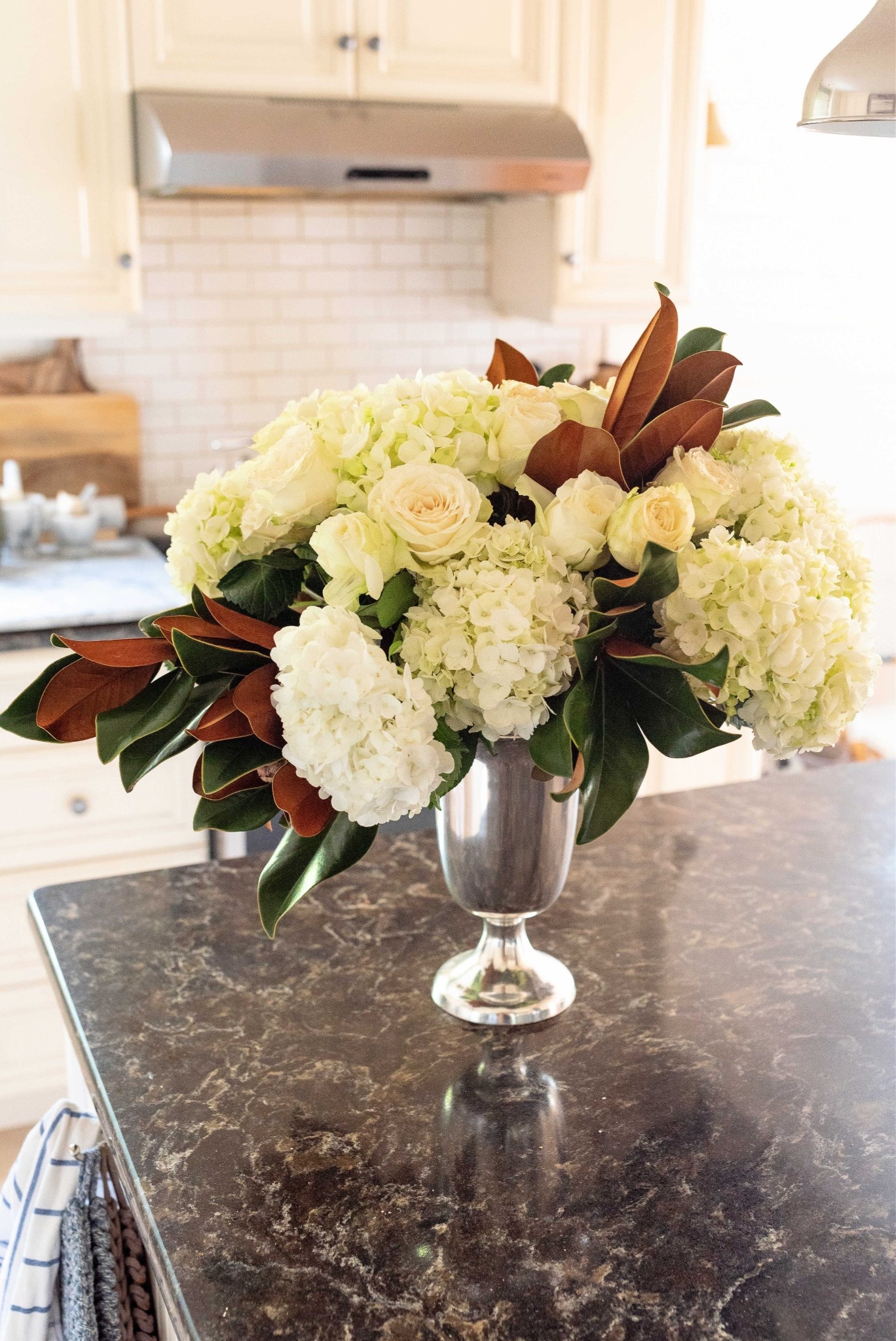 I love to add magnolia to my florals in the fall. This silver vase is a favorite to use this time of year.

#LTKHome #LTKFindsUnder50
