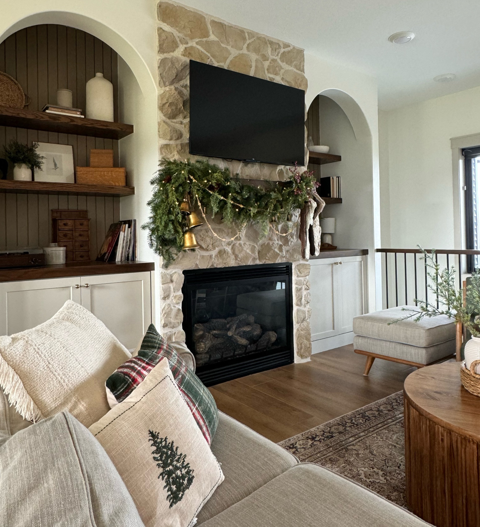 The asymmetrical mantle garland has all the heart eyes this year. I put bells on the opposite side of the stockings to balance it out.

#LTKHome #LTKHoliday #LTKSeasonal