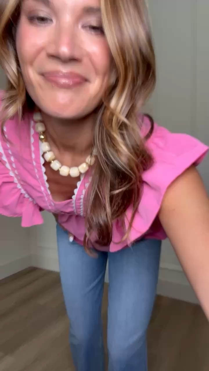 This outfit is such a fun statement moment for summer. The bright pink top with the ruffle detail instantly elevates a simple denim look, making it perfect for everything from lunch out to vacation evenings. Paired with classic denim and easy sandals, it’s the kind of outfit that feels bold but still effortless.

pink ruffle top, summer statement top, denim shorts outfit, wide leg denim jeans, casual chic outfit, vacation style, elevated basics, everyday outfit ideas, summer fashion inspo, mom style outfit, easy summer looks, StangandCo

#LTKootd #LTKSeasonal #LTKTall