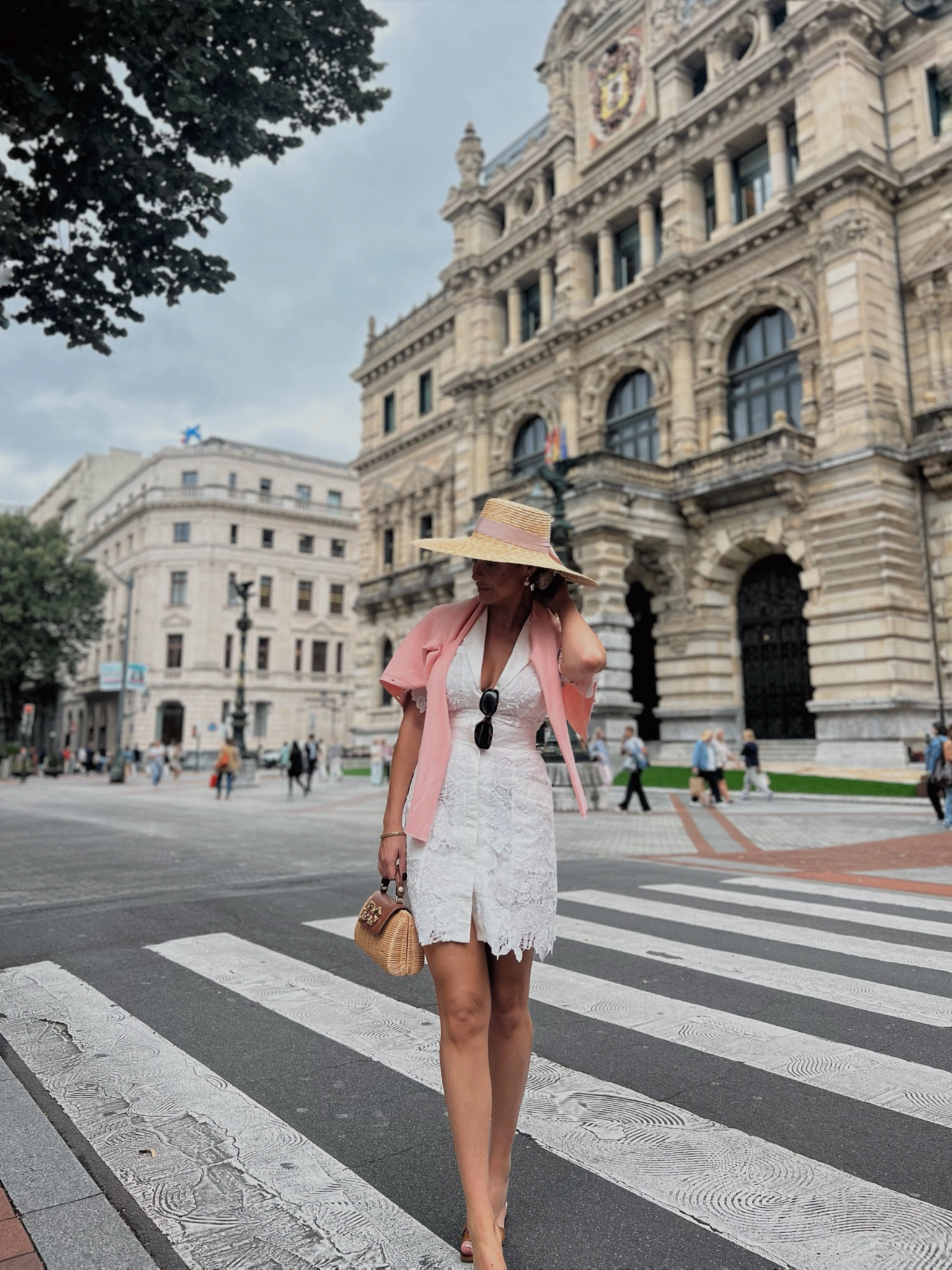 Pretty white dress on the streets of Bilbao 🤍 Broderie mini dress, coral cardigan & wicker sun hat 

#LTKeurope #LTKstyletip #LTKluxury