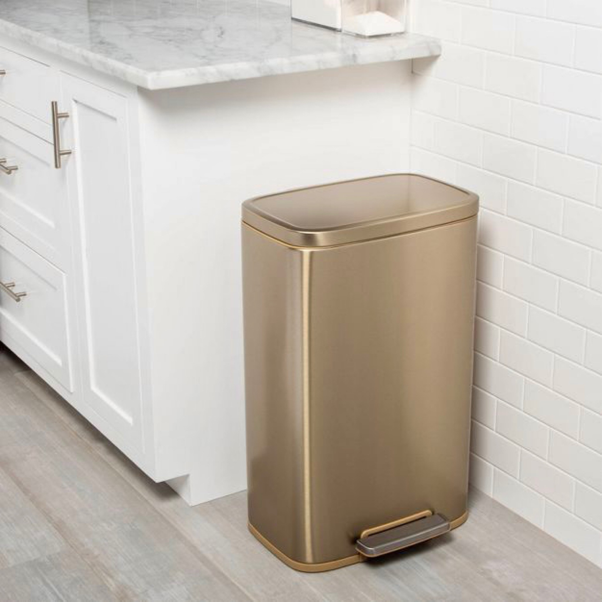 $50 gold trash can, step can kitchen garbage can target finds 

#LTKsalealert #LTKfindsunder50 #LTKhome