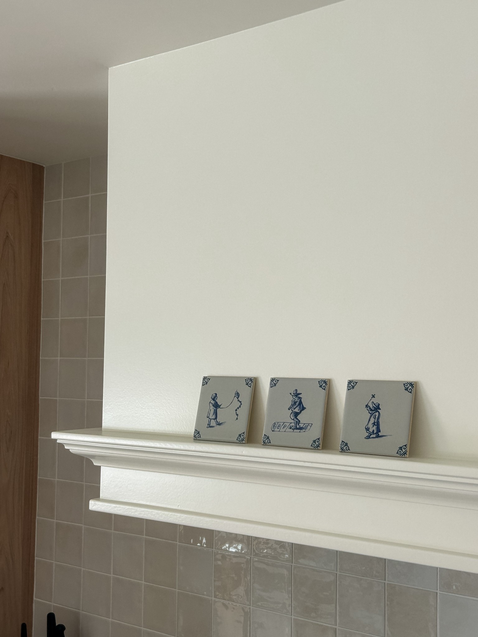 These little delft tiles are my absolute fave!! Vintage one of a kind that we found on eBay, but also try Etsy!

As for the hood - this was custom by our contractor. The trim is from Home Depot and the color is Swiss Coffee color-matched at Sherwin Williams in satin

#LTKHome